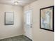 Bright entryway featuring a decorative front door, tile flooring, and neutral paint at 3301 Santa Barbara Dr, Punta Gorda, FL 33983
