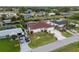 Charming home exterior with a well-manicured lawn, mature landscaping, and a paved driveway at 3301 Santa Barbara Dr, Punta Gorda, FL 33983