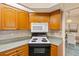 Kitchen featuring wood cabinets, stainless steel appliances, and countertops with tiled backsplash at 3301 Santa Barbara Dr, Punta Gorda, FL 33983