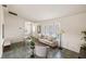 Bright living room showcasing large windows, neutral furniture, and tile flooring at 3301 Santa Barbara Dr, Punta Gorda, FL 33983