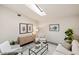 Well-lit living room with skylight, tasteful decor, and comfortable furniture at 3301 Santa Barbara Dr, Punta Gorda, FL 33983