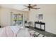 Cozy main bedroom with lanai access and a sitting area at 3301 Santa Barbara Dr, Punta Gorda, FL 33983