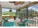 Screened-in lanai with table, chairs, and a glimpse of the swimming pool at 3301 Santa Barbara Dr, Punta Gorda, FL 33983