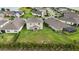 From above, the property reveals a generous lawn, beautiful landscaping, and a serene neighborhood ambiance at 3941 River Bank Way, Punta Gorda, FL 33980