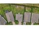 Aerial view of the neighborhood showing rooftops, green lawns, and beautiful landscaping at 3941 River Bank Way, Punta Gorda, FL 33980