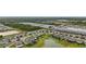 Scenic aerial view of the community with many homes, greenery, and multiple ponds at 3941 River Bank Way, Punta Gorda, FL 33980