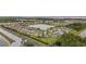 High aerial view of a community with pond views, many homes, and plenty of greenery at 3941 River Bank Way, Punta Gorda, FL 33980