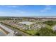 Beautiful aerial view of a community with lake views, lush landscaping, and well-maintained homes at 3941 River Bank Way, Punta Gorda, FL 33980