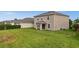 The home features a spacious backyard, perfect for outdoor entertaining, and a covered patio at 3941 River Bank Way, Punta Gorda, FL 33980