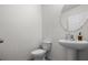 Powder room featuring a pedestal sink and classic design at 3941 River Bank Way, Punta Gorda, FL 33980