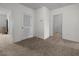 Neutral bedroom featuring carpet and two entryways at 3941 River Bank Way, Punta Gorda, FL 33980
