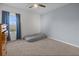 Bedroom featuring a plush mattress on the floor, blue accent wall, and a large window for natural light at 3941 River Bank Way, Punta Gorda, FL 33980