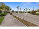 Elegant gated community entrance with lush landscaping and palm trees at 3941 River Bank Way, Punta Gorda, FL 33980