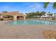 Large community pool with ample seating, cabana, and lush landscaping at 3941 River Bank Way, Punta Gorda, FL 33980