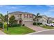 Charming two-story home with red shutters, a brick driveway, and a well-manicured lawn at 3941 River Bank Way, Punta Gorda, FL 33980