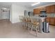 Kitchen with an island and breakfast bar that offers additional seating and counter space at 3941 River Bank Way, Punta Gorda, FL 33980