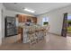 Eat-in kitchen featuring stainless steel appliances, tile floors and ample counter space for meal preparation at 3941 River Bank Way, Punta Gorda, FL 33980