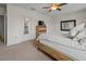Spacious bedroom featuring carpet, ceiling fan, dresser, and a mirror at 3941 River Bank Way, Punta Gorda, FL 33980