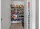Well-stocked pantry with wire shelving provides ample storage space for food and kitchen supplies at 3941 River Bank Way, Punta Gorda, FL 33980