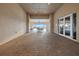Covered outdoor space with brick flooring that leads to the pool with tables and chairs at 3941 River Bank Way, Punta Gorda, FL 33980