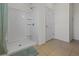 All-white walk-in shower with tiled walls and floor in the bathroom at 3941 River Bank Way, Punta Gorda, FL 33980