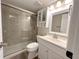 Stylish bathroom with tiled shower, vanity, and contemporary finishes at 4158 Tamiami Trl # A5, Port Charlotte, FL 33952