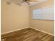 Cozy bedroom with wood-look floors, neutral walls, and natural light at 4158 Tamiami Trl # A5, Port Charlotte, FL 33952