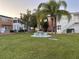 Community courtyard offers lush landscaping and seating areas, creating a serene outdoor retreat at 4158 Tamiami Trl # A5, Port Charlotte, FL 33952