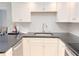 Clean kitchen showcases granite countertops, white cabinets, and modern fixtures at 4158 Tamiami Trl # A5, Port Charlotte, FL 33952