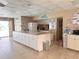 The common area features a kitchen with an island, perfect for communal dining at 4158 Tamiami Trl # A5, Port Charlotte, FL 33952