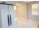 Bright living room featuring neutral paint and tile flooring, perfect for relaxing or entertaining at 4158 Tamiami Trl # A5, Port Charlotte, FL 33952