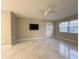 Inviting living room boasts neutral walls, ceiling fan, and access to the outdoors at 4158 Tamiami Trl # A5, Port Charlotte, FL 33952
