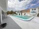 Relax and unwind by the community pool, surrounded by comfortable lounge chairs and lush landscaping at 4158 Tamiami Trl # A5, Port Charlotte, FL 33952