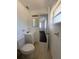 Cozy half-bath with tile flooring, a mirror, and a vanity with storage. A must see! at 514 Showalter Ave, Punta Gorda, FL 33950