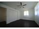This bedroom offers dark flooring and a ceiling fan and a closet for plenty of storage at 514 Showalter Ave, Punta Gorda, FL 33950