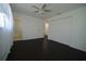 This bedroom offers dark flooring, natural light, and a ceiling fan for maximum comfort at 514 Showalter Ave, Punta Gorda, FL 33950