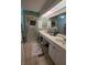 Well-lit bathroom featuring a shower, vanity, and charming nautical decor at 5800 Sabal Trace Dr # 1201, North Port, FL 34287