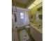 Well-lit bathroom with tub, vanity, and decorative rug at 5800 Sabal Trace Dr # 1201, North Port, FL 34287