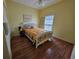 Bright bedroom with hardwood floors, a ceiling fan, and a comfortable bed at 5800 Sabal Trace Dr # 1201, North Port, FL 34287