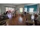 Bright and airy dining area with hardwood floors and views to an outdoor patio space at 5800 Sabal Trace Dr # 1201, North Port, FL 34287