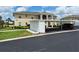 Charming two-story condo with well-maintained landscaping, covered parking, and convenient storage units at 5800 Sabal Trace Dr # 1201, North Port, FL 34287