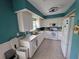Bright kitchen with white cabinetry, updated appliances, and a tile floor at 5800 Sabal Trace Dr # 1201, North Port, FL 34287