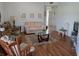 Comfortable living room showcasing hardwood floors, cozy seating, and serene decor at 5800 Sabal Trace Dr # 1201, North Port, FL 34287