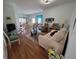 Inviting living room with hardwood floors, comfortable seating, and a bright, open layout at 5800 Sabal Trace Dr # 1201, North Port, FL 34287