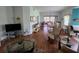 Bright living room with hardwood floors, comfortable seating, and lots of natural light at 5800 Sabal Trace Dr # 1201, North Port, FL 34287