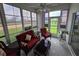 Cozy sunroom featuring patio view, comfortable seating, and natural light at 5800 Sabal Trace Dr # 1201, North Port, FL 34287
