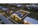 Aerial view of a house featuring a spacious fenced yard and lush landscaping at 6286 Coniston St, Port Charlotte, FL 33981
