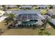 Overhead shot of a home with a screened-in pool, landscaped yard, and well-kept surroundings at 6286 Coniston St, Port Charlotte, FL 33981