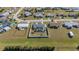 Aerial view of the property highlighting the fenced yard, screened pool, and surrounding neighborhood at 6286 Coniston St, Port Charlotte, FL 33981