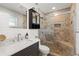 Bathroom featuring a white vanity top and a dark wood cabinet and a glass-enclosed tiled shower at 6286 Coniston St, Port Charlotte, FL 33981